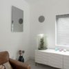 Herschel Inspire Infrared Mirror Panel in living room