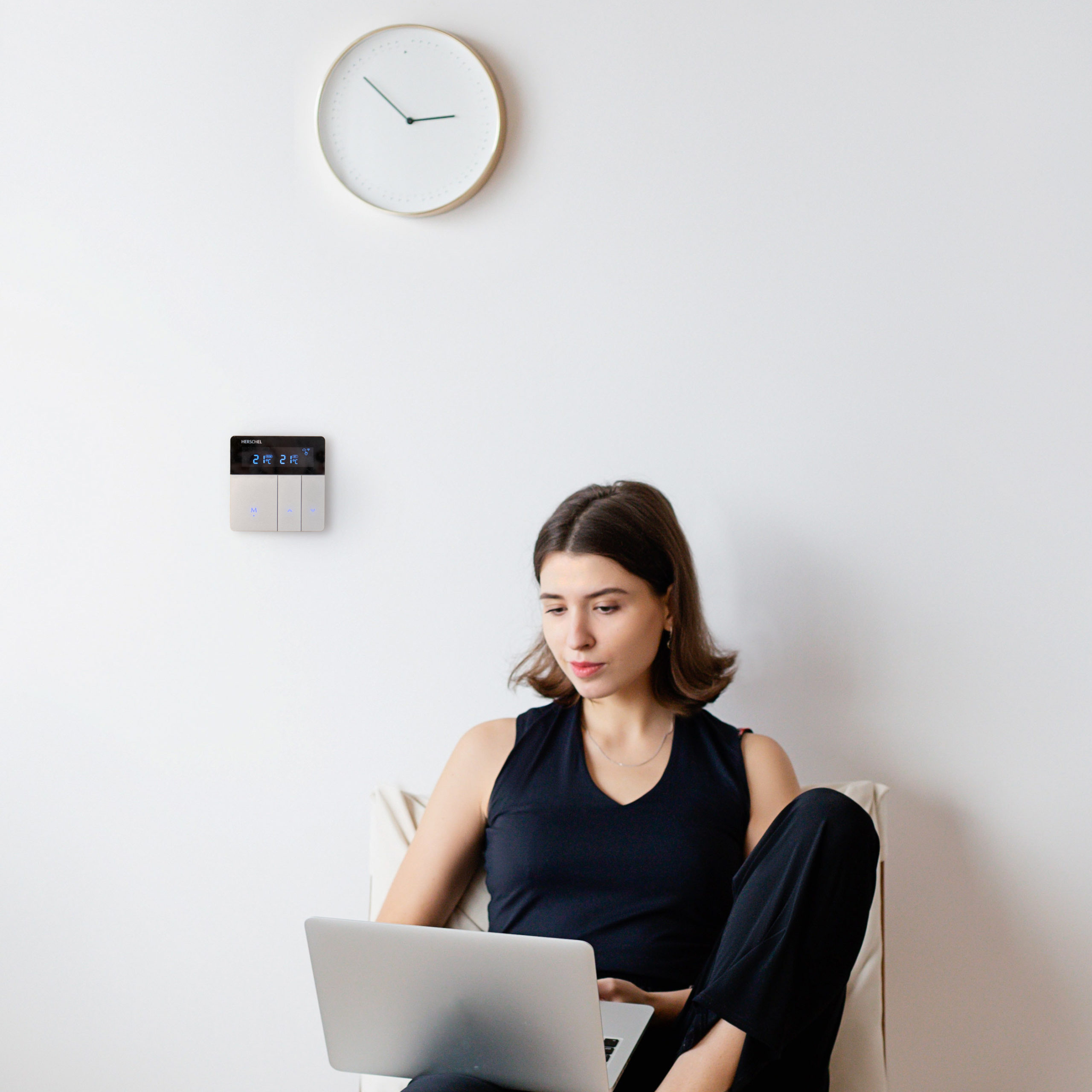 Stylish, modern WiFi thermostat installed on wall