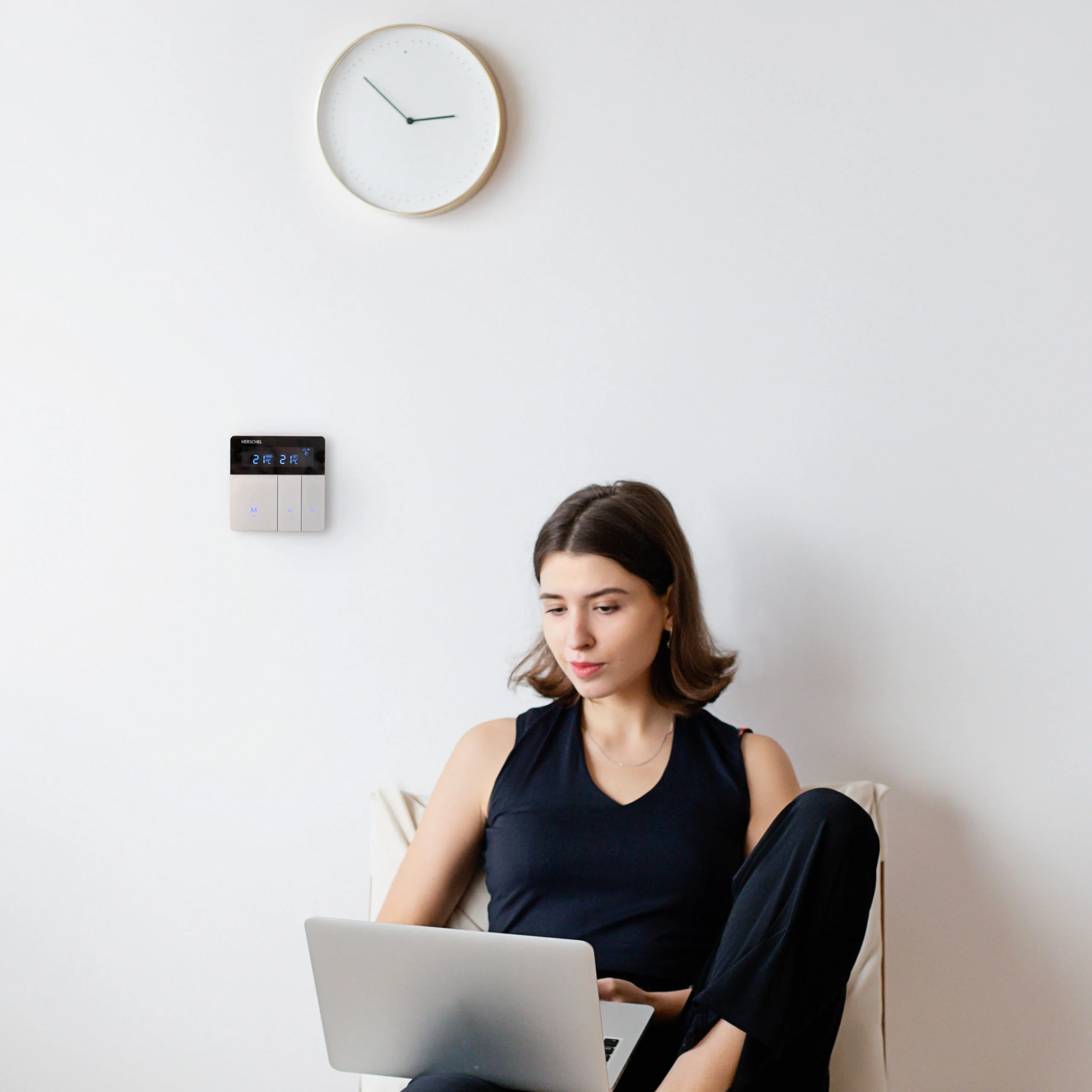 Stylish, modern WiFi thermostat installed on wall